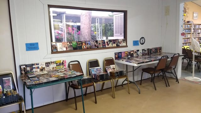 The clubhouse rec room, with tables of movies to borrow